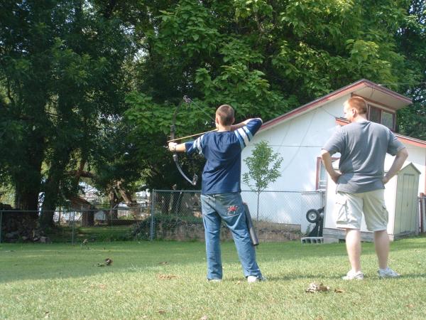 Larry and John target shooting the bow and arrows